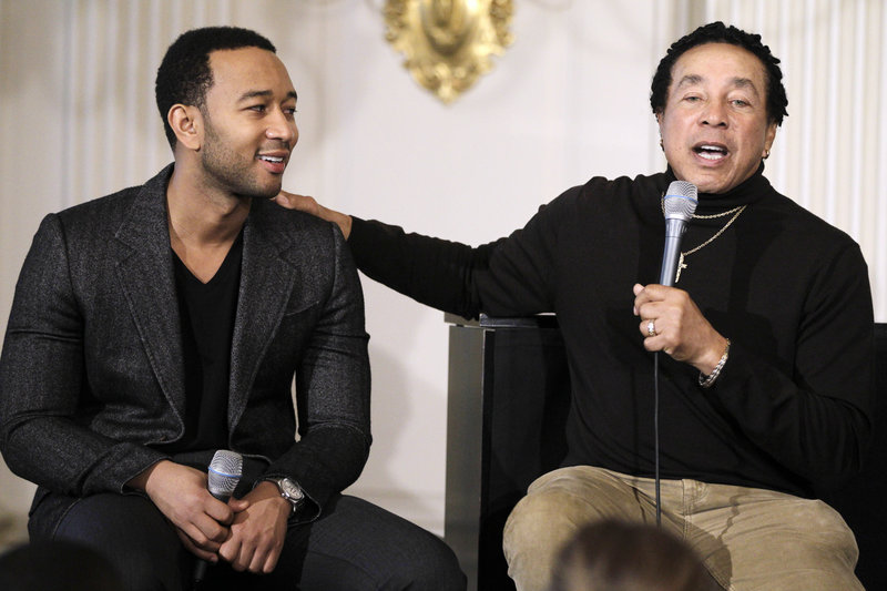 Singers Smokey Robinson, right, and John Legend talk at a music workshop highlighting Motown artists hosted by Michelle Obama on Thursday.