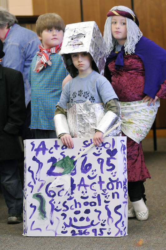 Students from Acton Elementary School wait to perform during Money Maker. From left are Sam Toussaint, 8, Spencer Phillips, 6, and Hunter Ham, 8.