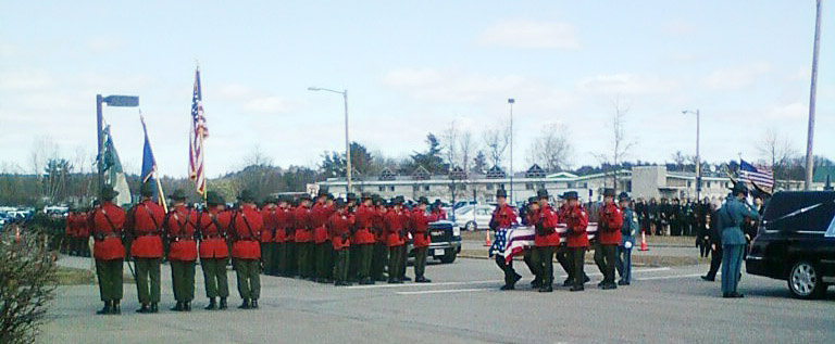Maine Game Wardens carry the casket of Daryl Gordon to the Augusta Civic Center today.