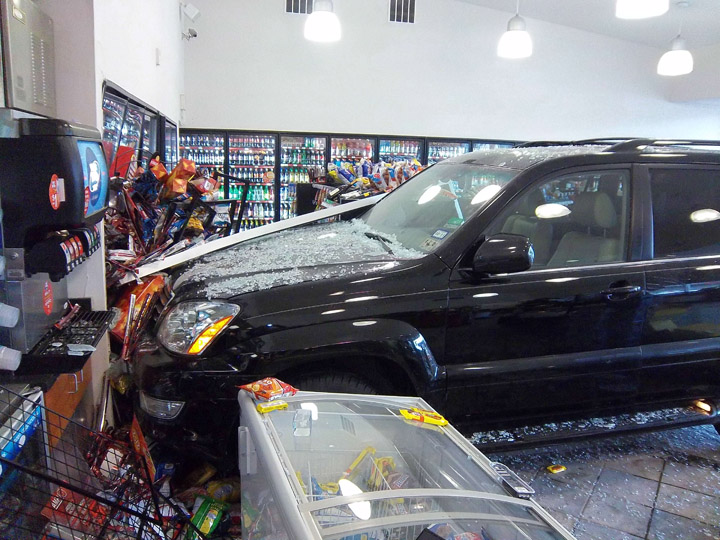 This photo provided by the Kennebunk Police Department shows where the vehicle came to a stop after crashing through a front window.