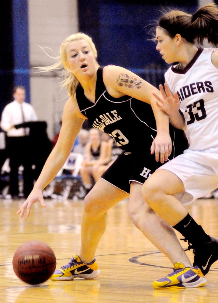 Hall-Dale guard Carylanne Wolfington tries to get past Washington Academy's Brandelyn Hodgdon. Wolfington led Hall-Dale with 20 points.