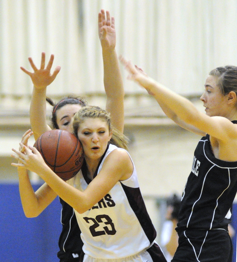 Washington Academy guard Christy Smith is double teamed by Hall-Dale's Wendy Goldman, left, and Kristina Buck.