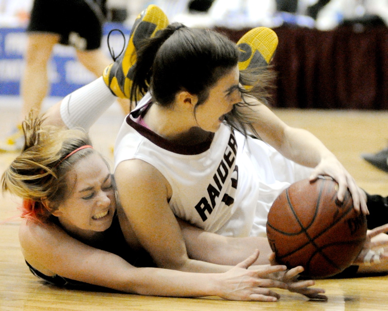 Hall-Dale guard Kristen Moody, left, and Washington Academy forward Jessa Cushing dive for a loose ball during the Class C girls' state championship game at the Bangor Auditorium.