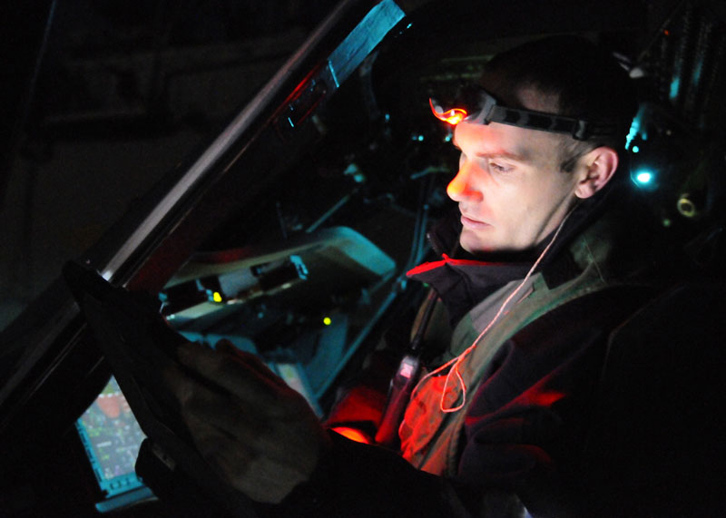 In this March 19, 2011 photo provided by the U.S. Navy, Aviation Electrician's Mate 2nd Class Joseph Fremen, assigned to Helicopter Sea Combat Squadron 22, calibrates the forward looking infrared system of a Sea Hawk helicopter on the flight deck of amphibious assault ship USS Kearsarge in the Mediterranean Sea. After a barrage of attacks by sea-launched Tomahawk cruise missiles on Libya Saturday, an array of U.S. warplanes _ including several Air force B-2 stealth bombers _ followed in the pre-dawn hours Sunday with a coordinated assault using precision-guided bombs, according to a U.S. military official. amphibious assault ship USS Kearsarge (LHD 3) Libya Odyssey Dawn