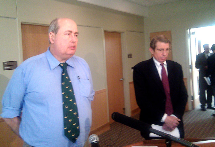 Board member Jim Cloutier, left, announces the appointment today of former state Sen. Peter Mills as the interim executive director of the Maine Turnpike Authority.
