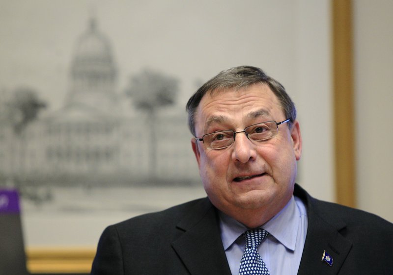 Gov. Paul LePage speaks at a news conference at the State House on Thursday. “We are going to reduce our debts,” the governor said.