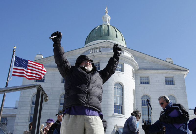 Bruce Hodsdon, president of the Maine State Employees Association, leads a rally of state workers in opposition to Gov. Paul LePage’s budget proposal outside the State House on Thursday.