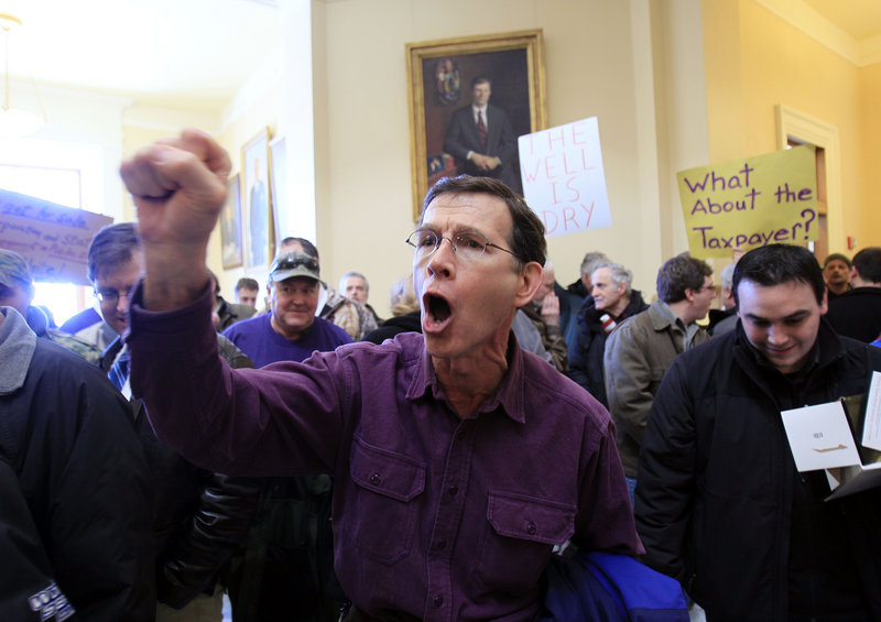 Michael Hudson of Gardiner, a 27-year state employee, chants in opposition to the retirement benefit cuts. Others favored the plan. “We’re spending too much. We’ve got to cut back,” said Ray Hutton of Bath.