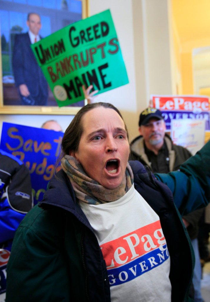 Debbie Barry of Lisbon Falls shouts her support for the governor’s budget proposal during a rally inside the State House.