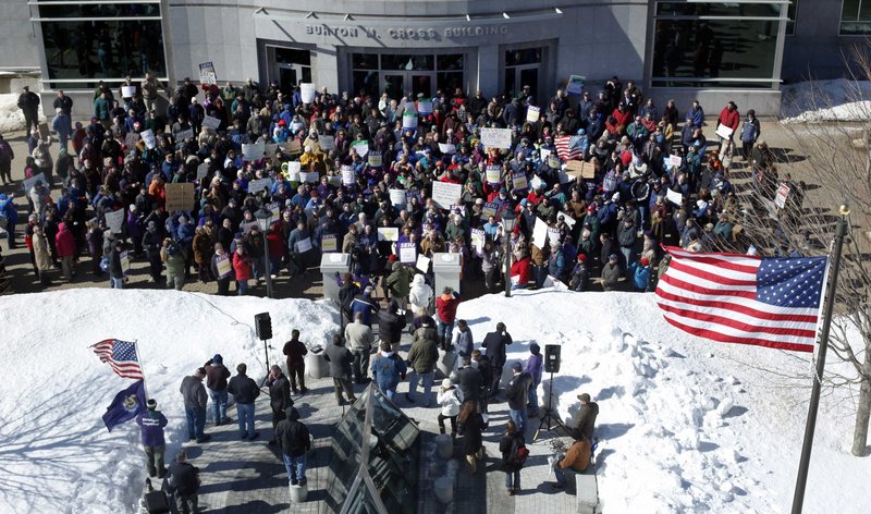 State workers gather to oppose Gov. Paul LePage's budget proposal during a rally Thursday outside the State House. "We don't need a budget that attacks working Maine families," MSEA President Bruce Hodsdon said.