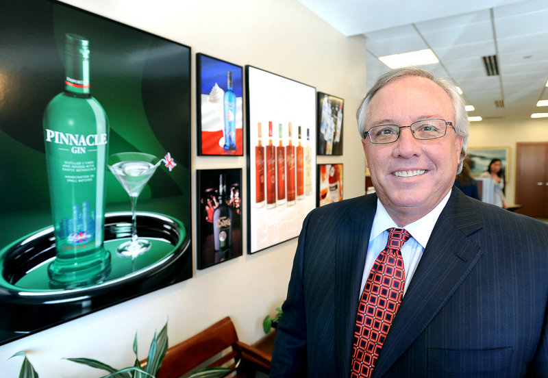 Paul Coulombe, CEO of White Rock Distilleries, shown at his office in Portland, began in the business as a salesman. The company has evolved into bottling, branding and distribution.