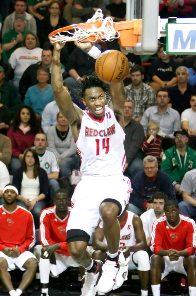 Jamar Smith of the Red Claws jams the ball against the Armor on Sunday at the Portland Expo. Smith finished with 15 points.