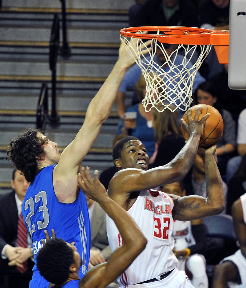 DeShawn Sims of the Red Claws powers a shot past Joe Alexander of the Texas Legends for two of his team-high 18 points in a 117-94 loss Friday night at the Cumberland County Civic Center.