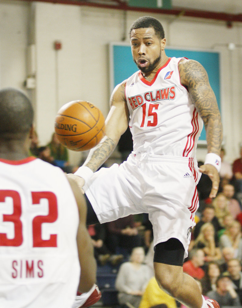 Antonio Anderson of the Maine Red Claws dishes a pass to teammate DeShawn Sims during the second quarter of a 105-100 victory against the Fort Wayne Mad Ants in the home finale Thursday night. Maine finished with a 14-11 record at home.