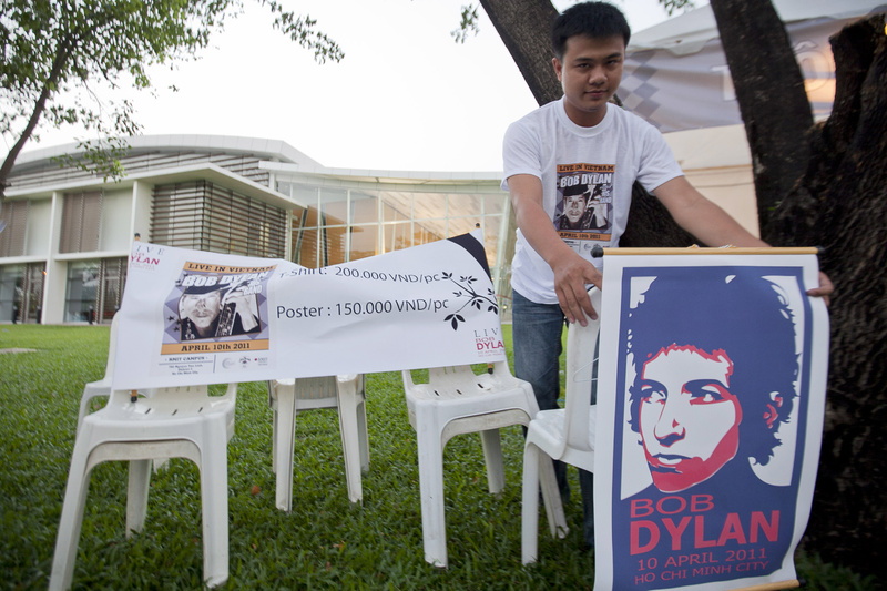 A Vietnamese student prepares a stall to sell T-shirts and posters of the concert named "Bob Dylan - Live in Vietnam," a one night only show held at RMIT University in Ho Chi Minh City, Vietnam today. After nearly five decades of singing about a war that continues to haunt a generation of Americans, legendary performer Bob Dylan is finally getting his chance to see Vietnam at peace.