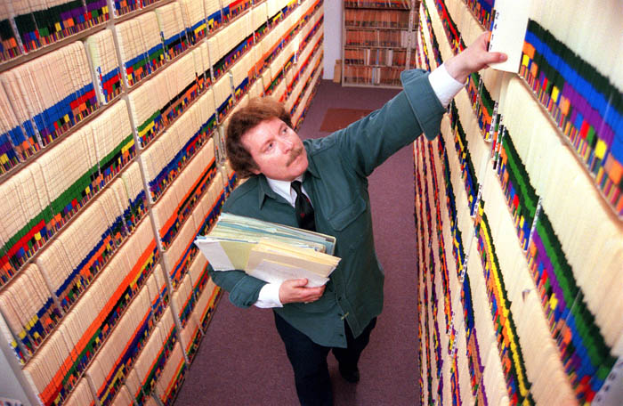 In this 2001 photo, Herb Adams, who was then Cumberland County Probate Court Clerk, looks for a will in the courthouse attic storage area.