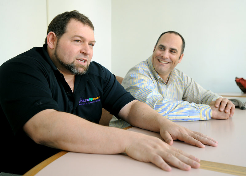 CEO Craig Handley, left, and President Tony Ricciardi of Listen Up Español work from an office in Portland.