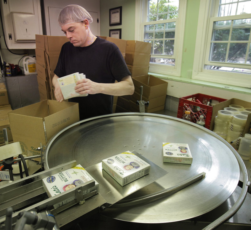 Tim Heffernan boxes up butter at Kate’s Homemade Butter in Old Orchard Beach.