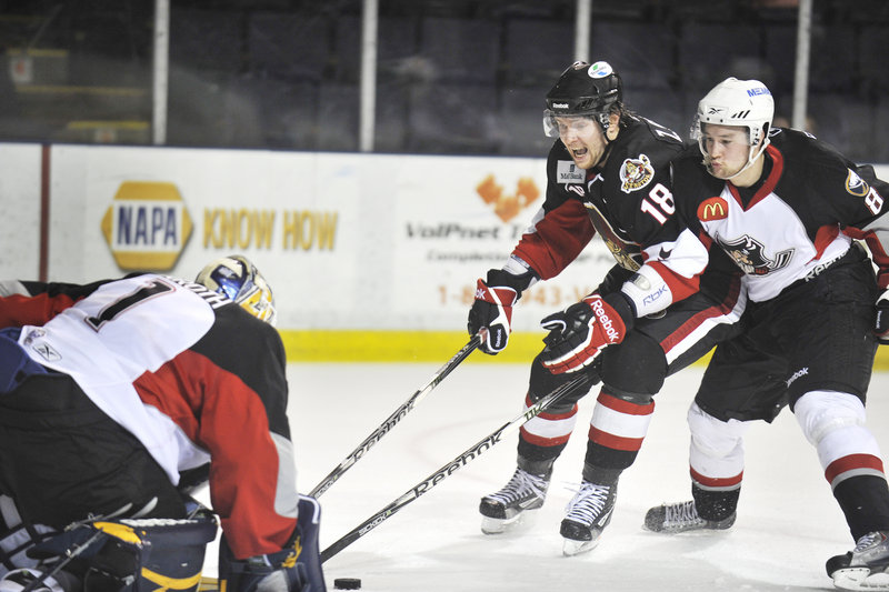 Pirates goalie Jhonas Enroth gets help from defenseman Dennis Persson, right, and blocks a breakaway shot by Binghamton’s Zack Smith during Game 2 of their AHL playoff series Thursday night at the Cumberland County Civic Center. The Senators won to take a 2-0 series lead.