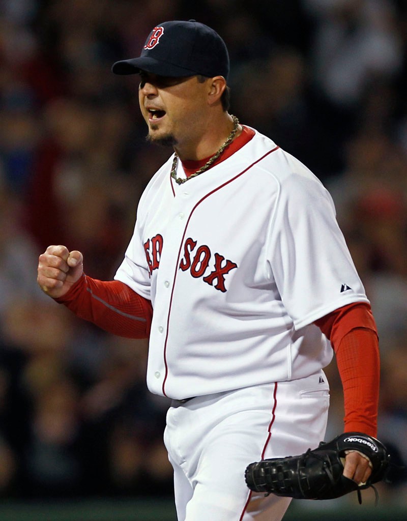 Boston pitcher Josh Beckett pumps his fist after the Red Sox turned a double play against the New York Yankees during the third inning Sunday night at Fenway Park in Boston.