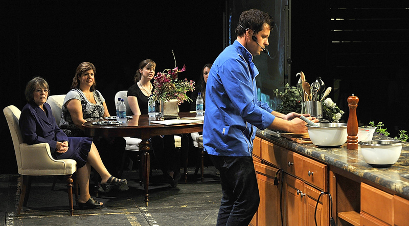 Four Divas who found gold tickets under their chairs enjoy the show from a table on the stage and watch as Celebrity Chef Jon Ashton of the weekly food magazine Relish prepares a dish for the audience Thursday night at the Portland Exposition Building.