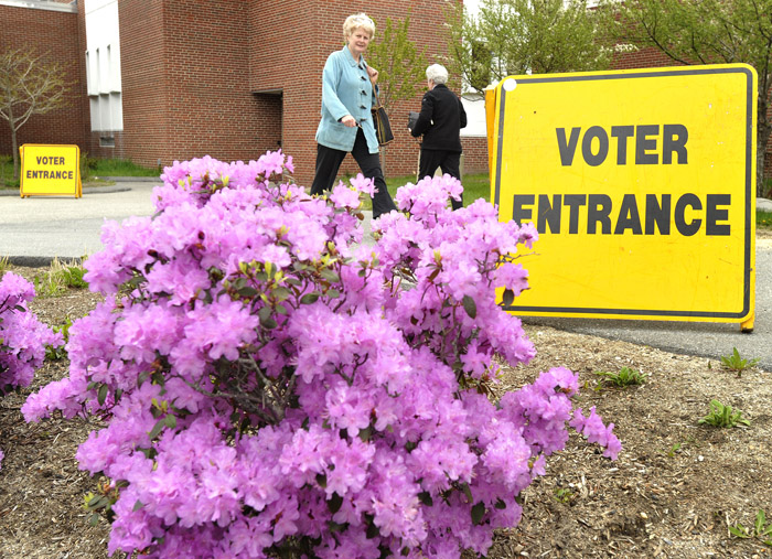 Cape Elizabeth voters come and go at the high school as they turned out to cast their votes in today's election.