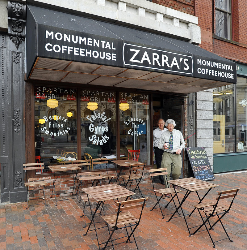 Customers head to the outside seating area on Monument Square.