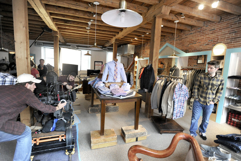 An independent film crew shoots a scene with actor Adam Scott inside Joseph's Clothing Co. on Fore Street in Portland on Thursday. The crew, and Scott worked for about two hours after an earlier shoot at the Brian Boru bar.