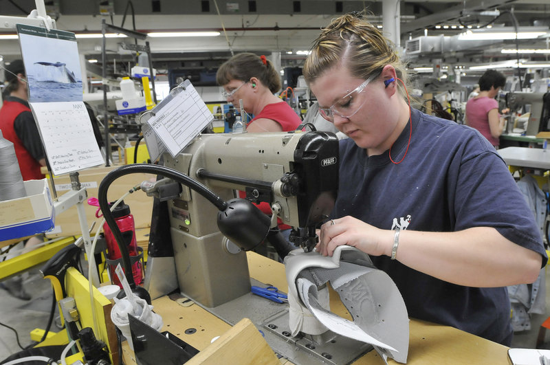 Ashley Smith stitches shoes at New Balance in Norridgewock. Shoes are assembled in steps that take 44 seconds.