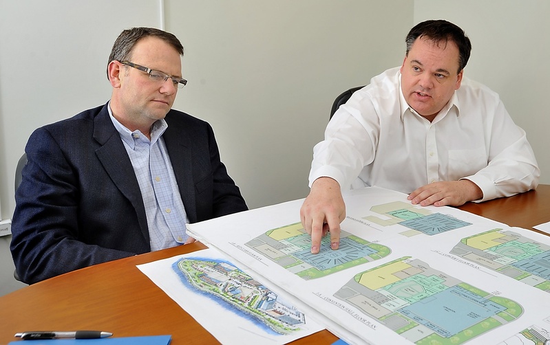 Bill Ryan Jr., left, and Jon Jennings, discuss plans to develop Thompson's Point into an arena/convention center complex they call "The Forefront at Thompson's Point" during a meeting in April. City councilors approved a tax break for the project Monday night.