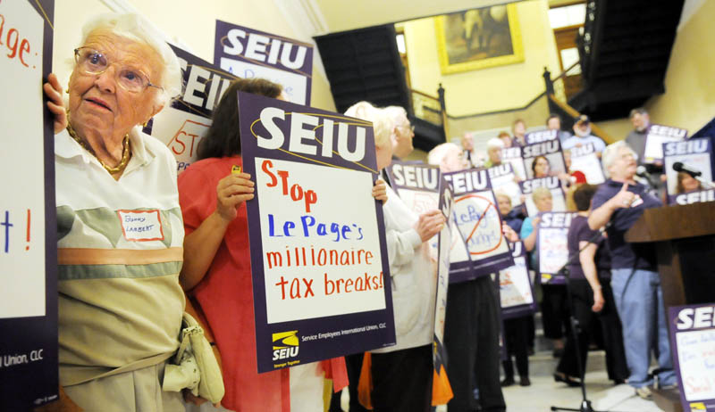 Bunny Lambert, 89, stands in line with other retired state employees this week during a rally outside the governor’s office in Augusta. The retirees were protesting changes proposed by the LePage administration to their retirement packages. Lambert, of Augusta, joined more than180 state workers at the rally.