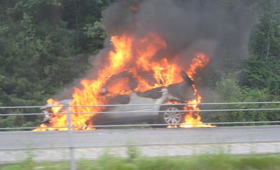 A 2011 Subaru Forester burns in the breakdown lane of Interstate 295 in Cumberland. Both northbound lanes of I-295 were shut down for about 30 minutes this evening.