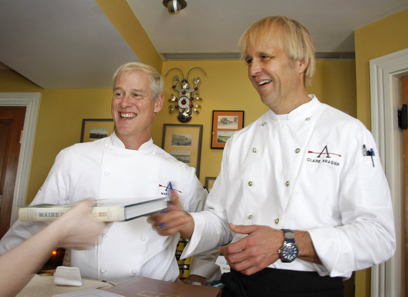 Chefs Mark Gaier and Clark Frasier sign copies of their new cookbook, "Maine Classics: More Than 150 Delicious Recipes From Down East," at a recent book launching celebration at their MC Perkins Cove in Ogunquit.