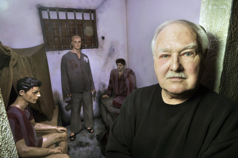 Lee Humiston will welcome state officials and hundreds of guests, including former prisoners of war, at the grand opening of the Maine Military Museum and Learning Center in South Portland on Saturday. Here he stands outside a replica of a North Vietnamese prisoner of war cell he created from artifacts he had collected.