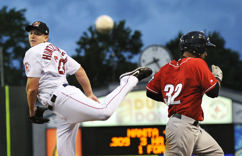 Portland starter Brock Huntzinger looks back as a throw from shortstop Vladimir Frias sails past him during a double-play attempt, allowing New Hampshire’s Ricardo Nanita to reach first base. The Sea Dogs lost for the first time in four games.