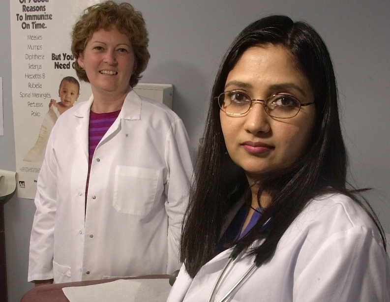 Dr. Shadan Mansour and a nurse practicing in a rural health clinic are shown in this 2002 file photo. A Maine doctor says there will be fewer physicians if current policies go on much longer.