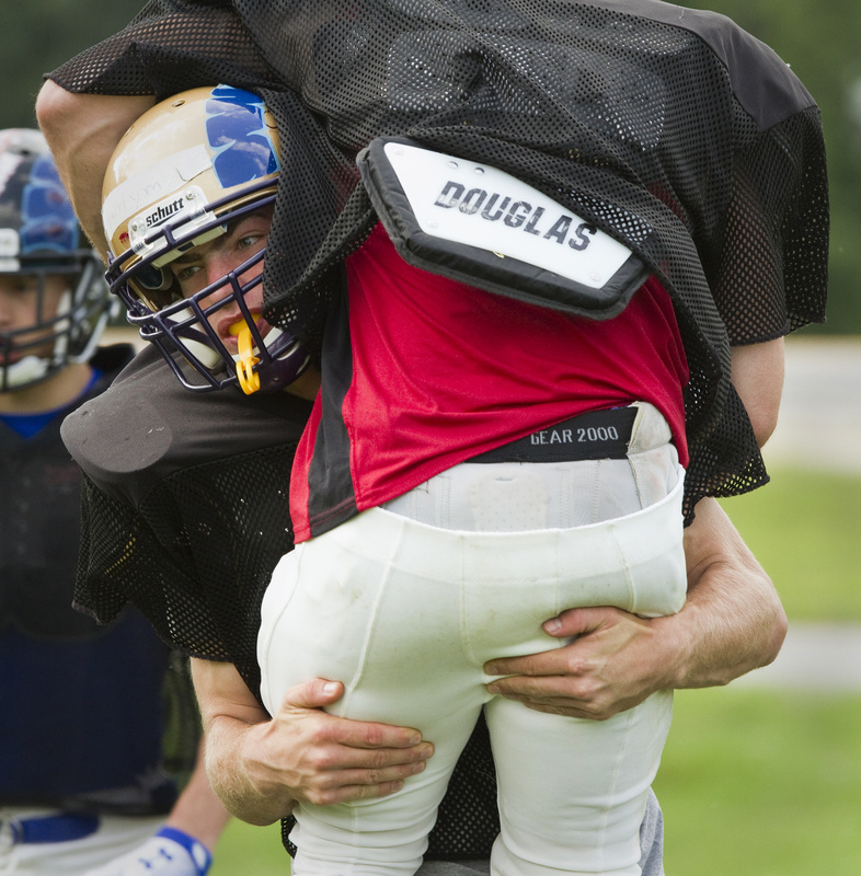 Peter Gwilym, facing, noticed a real difference between all-star basketball games and the Lobster Bowl football game, where the expectation to play hard and win is obvious.