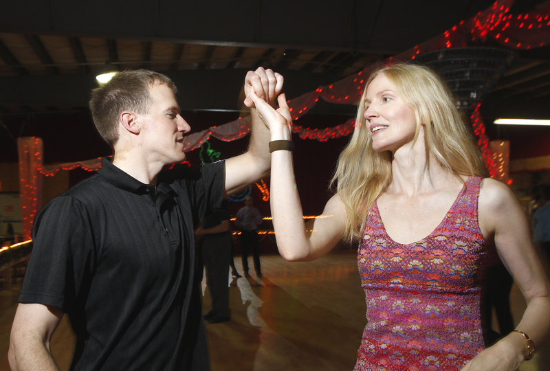 Aaron Fox of Old Orchard Beach swing dances with Dorota Lech of Portland. Maplewood Dance Center owner Joan Vance says TV contests encourage people to learn to dance.