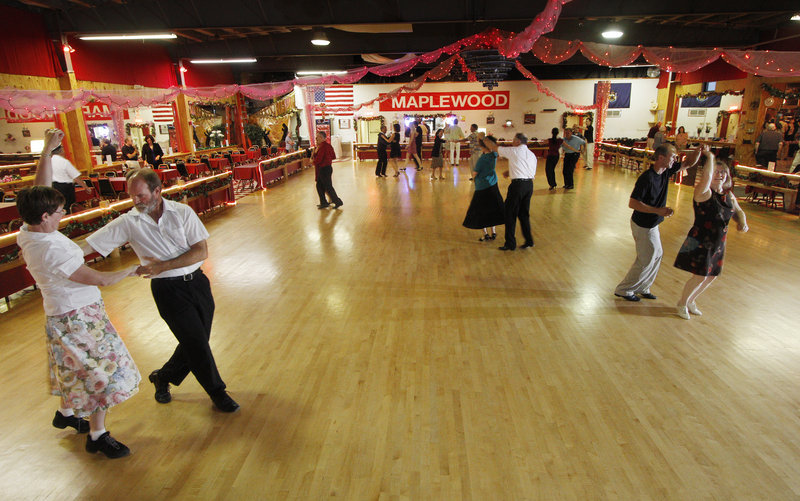 Couples learn new moves Wednesday in a ballroom dance lesson at Maplewood Dance.