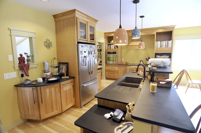 In the kitchen, countertops are made of recycled materials, and work areas are extra wide to allow for wheelchair or walker use.