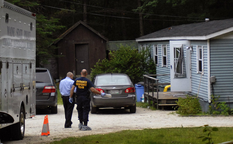 A man who works near the mobile home, above, reported hearing three shots Monday, followed by a dialogue in which a girl said “He didn’t do anything,” then three more shots.