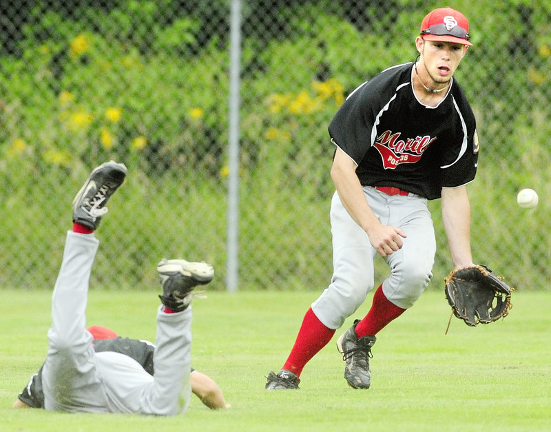 Shawn Shannon, the right fielder for Morrill Post, goes for the ball Friday while backing up a diving attempt at a catch by second baseman Jack Lano. Morrill was eliminated by Brewer, which advanced to face Augusta today.