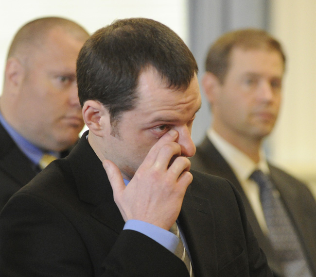 Jason Twardus wipes away a tear as a family member speaks for him before he is sentenced to 38 years for the murder of Kelly Gorham in 2007.