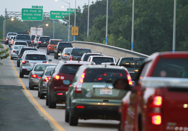 Cars clog the roadway to the Hampton Roads Bridge Tunnel as Hurricane Irene approaches, Thursday, Aug. 25, 2011, in Norfolk, Va. Forecasters at the National Hurricane Center Thursday afternoon also issued the first warnings for the entire North Carolina coast to the Virginia border. One is also out for the coast of South Carolina from Edisto Beach north. (AP Photo/Steve Helber)