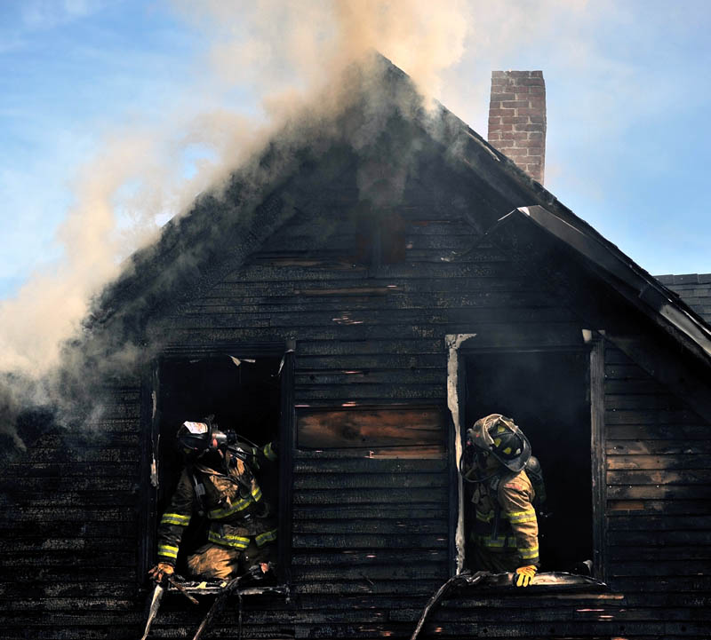 Staff photo by Michael G. Seamans Forty firefighters from four agencies including Waterville, Winslow, Fairfield and Oakland Fire Departments, responded to a house fire on Oak Street in Waterville Tuesday morning. No injuries were reported.