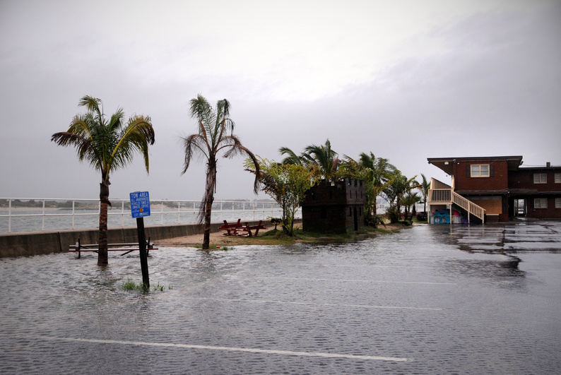 Water pools in a parking lot at the Ocean City Inlet in Maryland today as the outer bands of Hurricane Irene cover the area. weather hurricane irene
