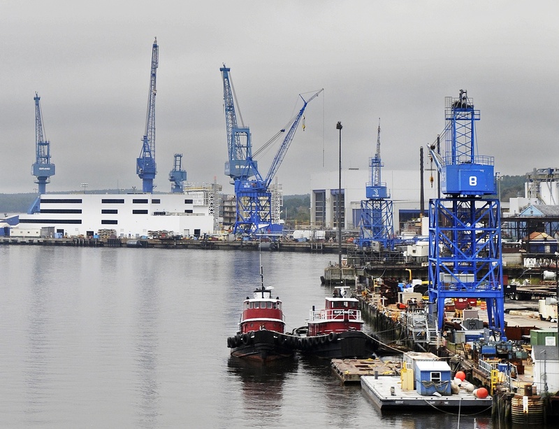 Cranes tower over Bath Iron Works on the Kennebec River waterfront. 