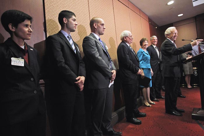 The news conference on Capitol Hill today included Marine Reservist Capt. Sarah Pezzat from West Bloomfield, Mich. left; Air Force Staff. Sgt. Jonathan Mills from Pensacola, Fla., Air Force 1st Lt. Josh Seefried from Longmont, Colo; Sen. Carl Levin, D-Mich.; Sen. Susan Collins, R-Maine; and Sen. Mark Udall, D-Colo. Sen. Joe Lieberman, I-Conn., is speaking at right.