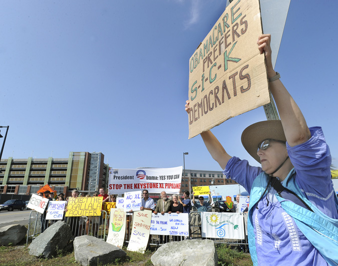 Among protesters greeting the arrival of Michelle Obama's motorcade this afternoon is Nancy Page Akers of Portland.