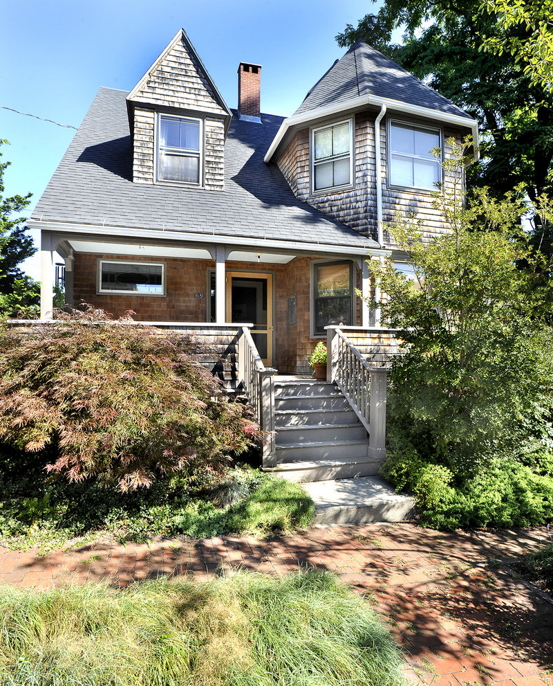 Margo Halverson and Charles Melcher’s Portland home was designed by John Calvin Stevens. The front facade evokes the renowned architect’s signature style.